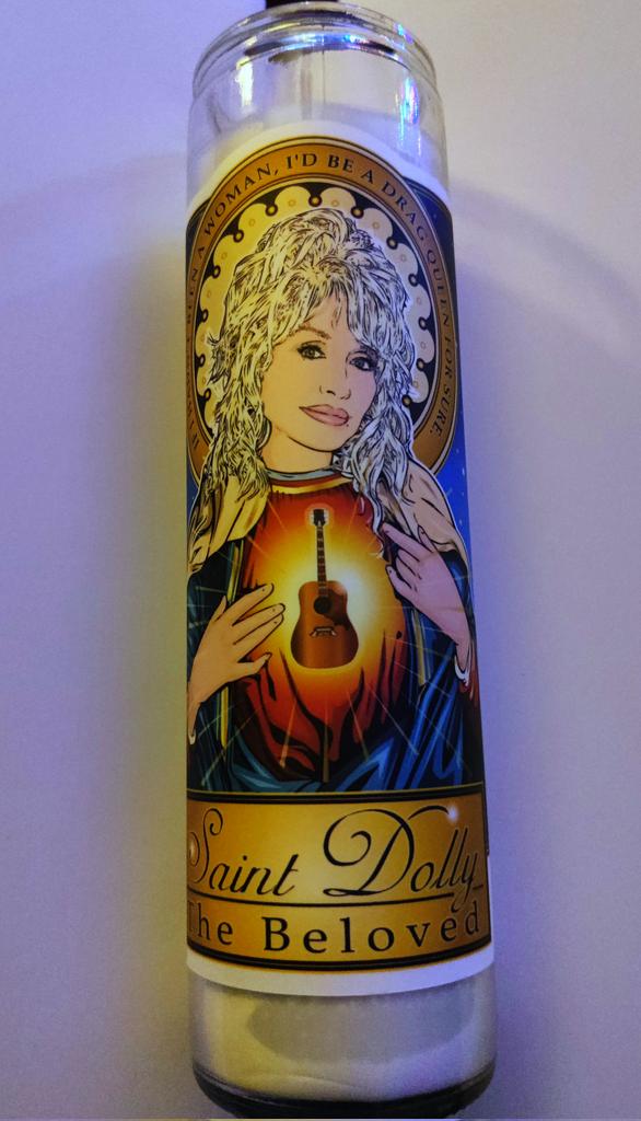 aguynamedbrad's tweet photo. Gotta show my excitement for this @DollyParton prayer candle my boyfriend got me for Christmas 😍 The quote says "If I hadn't been a woman, I'd be a drag queen for sure." https://t.co/aThNVIadSw
