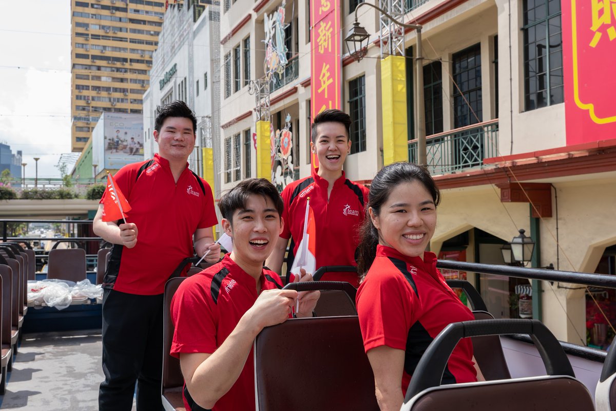 MothershipSG's tweet photo. Members of public wave enthusiastically to Team S'pore world champions in heroes' parade https://t.co/ziUW2BBnfk https://t.co/YzdwfPly9q