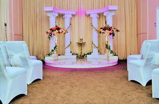 [Takes my place at the altar, watching the guests start to arrive and seeing <a href="/AShadowOfWings/">Dorian Riva</a> walk in to join me at the front with <a href="/FadingVitality/">Elliot Indigo</a>, bidding a grin to <a href="/ALovelyTease/">Allison Sullivan</a> as she takes her place as well.] All rise please.