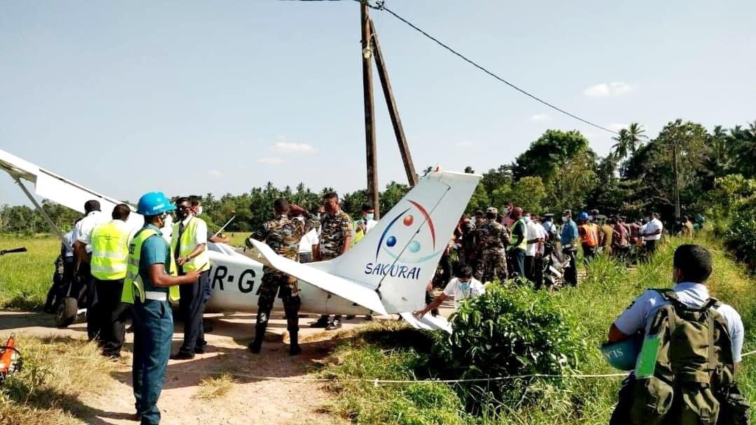 shehanmlive's tweet photo. Two foreign passengers &amp; a pilot injured &amp; hospitalised after a private Cessna 172 aircraft belonging to Sakurai Airlines made an emergency landing in the Kimbulapitiya area in Katunayake https://t.co/alVFCGVHoO