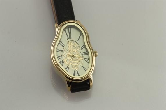 im in love with these salvador dali inspired watches. i want, i want, i want!