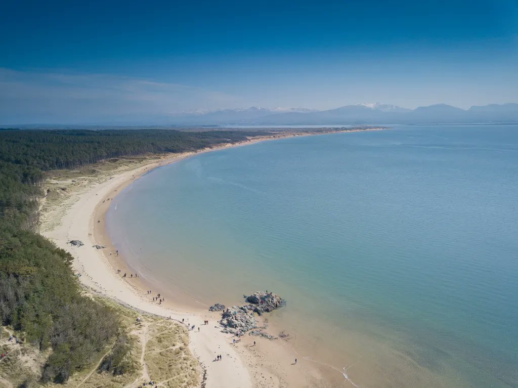 An aerial view of Llanddwyn beach and Newborough forest, Anglesey.
By januszkurek.com

#WalesCoastPath #LlwybrArfordirCymru #Anglesey