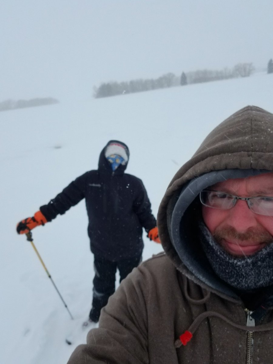 Kenneth_Reimer's tweet image. A bit blustery in the middle of the field, but now there's lots of snow to go showshoeing. We went to the bush in the background and back.  We're halfway home in the picture.