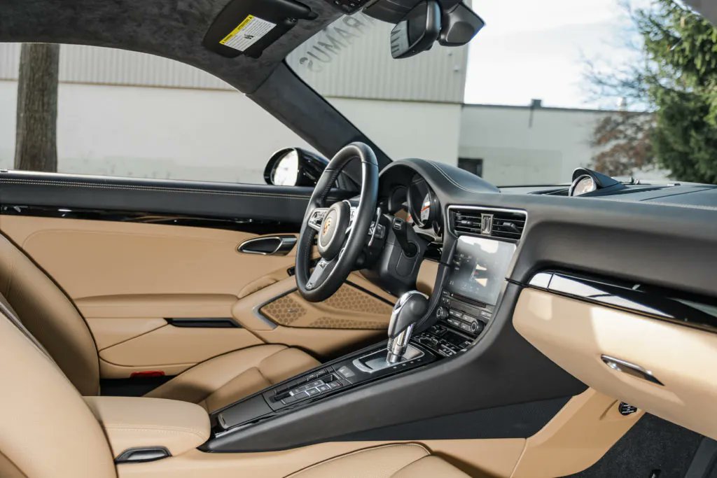 PorscheMarket's tweet photo. This 2019 #Porsche 911 Carrera 4S is finished in Black over a Luxor Beige leather interior. It only has 3,580 original miles and is equipped with a PASM Sport Suspension that lowered the vehicle 20mm. #PorscheMarketplace

▶️ https://t.co/Sz9YT4ERRn https://t.co/MQ8i5sQkUZ