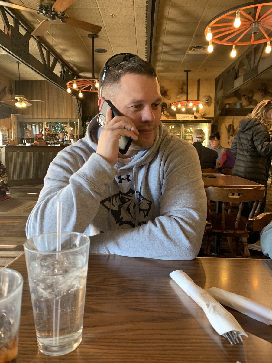 LindaCimpl's tweet photo. Normally this would be @CoachCimpl on the phone with a recruit. However, this is a picture of him on the phone with dispatch from 911 after he accidentally hit the emergency button on his phone while eating lunch at Al’s Oasis. #Somebodycall911 #YesImOkay 🤣🤦🏼♀️ https://t.co/GIKP5aMztQ