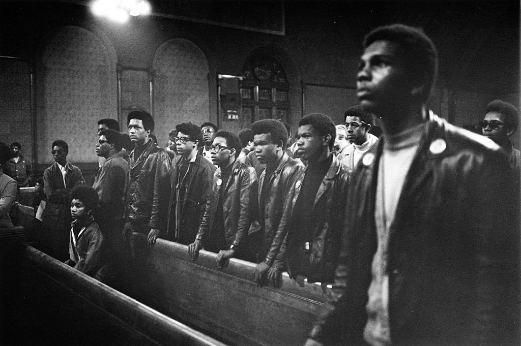 60sto70sto80s's tweet image. Young Black men listen to Black Party chairman Fred Hampton speak at the Church of the Epiphany. Photo by Paul Sequeira (1969)
