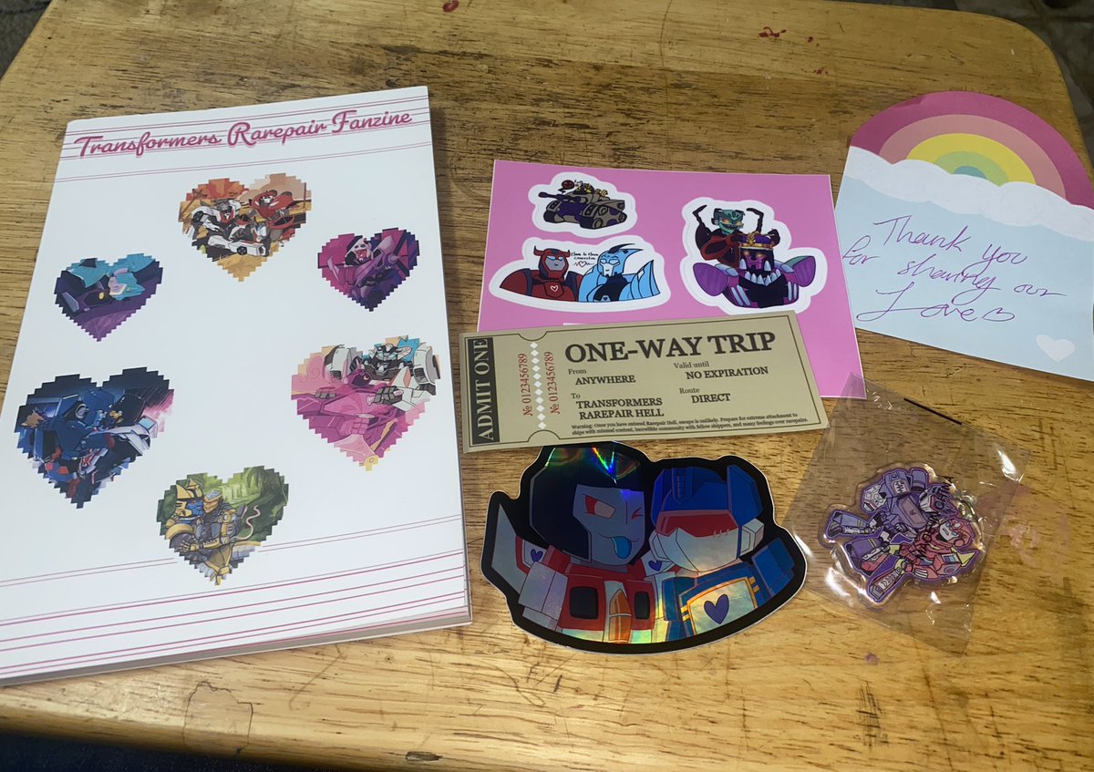 InaliaKitsune's tweet photo. My copy of @TfRarepairZine finally came in! ♥️  I love it so much 😭 https://t.co/CoFZ5VOSle