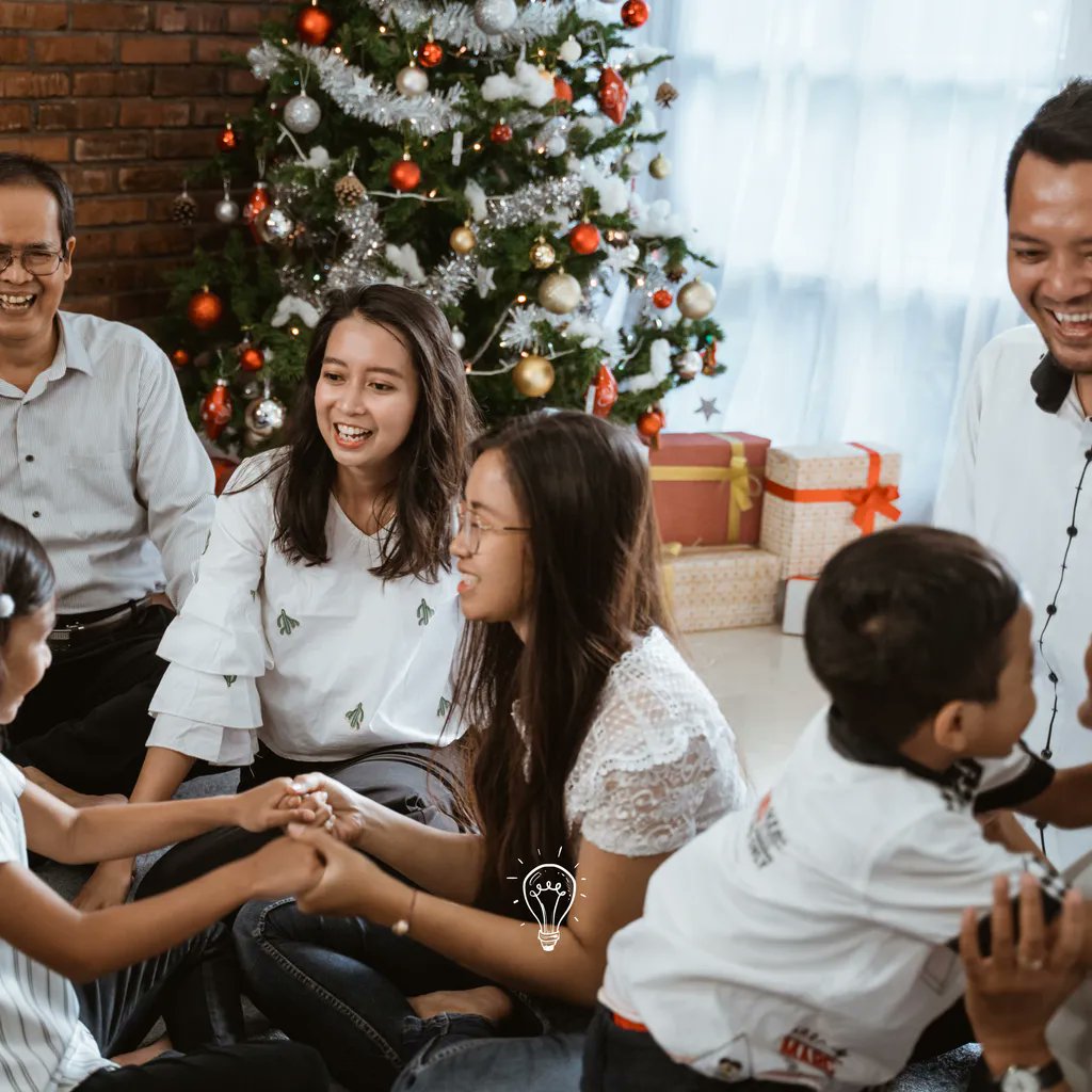 The best of all gifts around any Christmas tree: the presence of a happy family all wrapped up in each other.