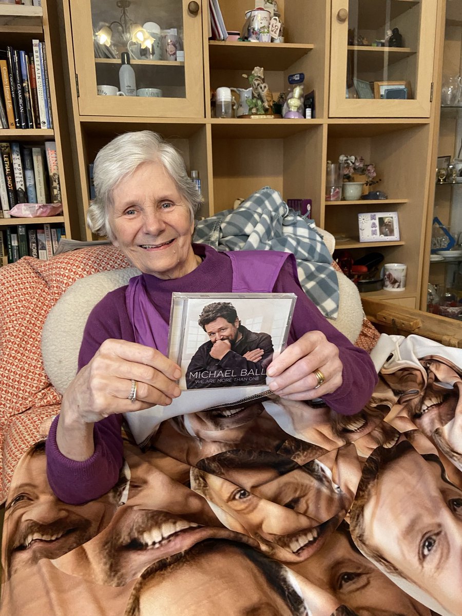 sarah79736794's tweet photo. Mum with @mrmichaelball merch. Mum got diagnosed with Alzheimer’s and vascular dementia in 2019 and since has loved her music, especially Michael Ball. She constantly says how handsome he is so I decided to surprise her this Christmas. “Now you can sleep with Michael Ball, mum”😂 https://t.co/PEA9BMOJA0
