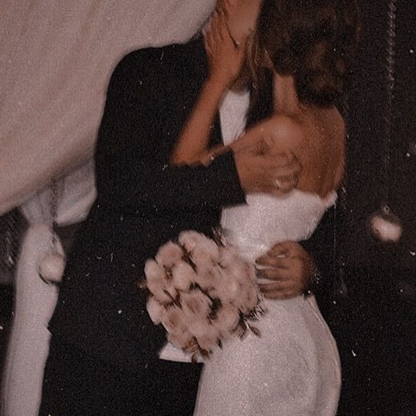 rose and connor passionately kissing right after their wedding, taken by a guest