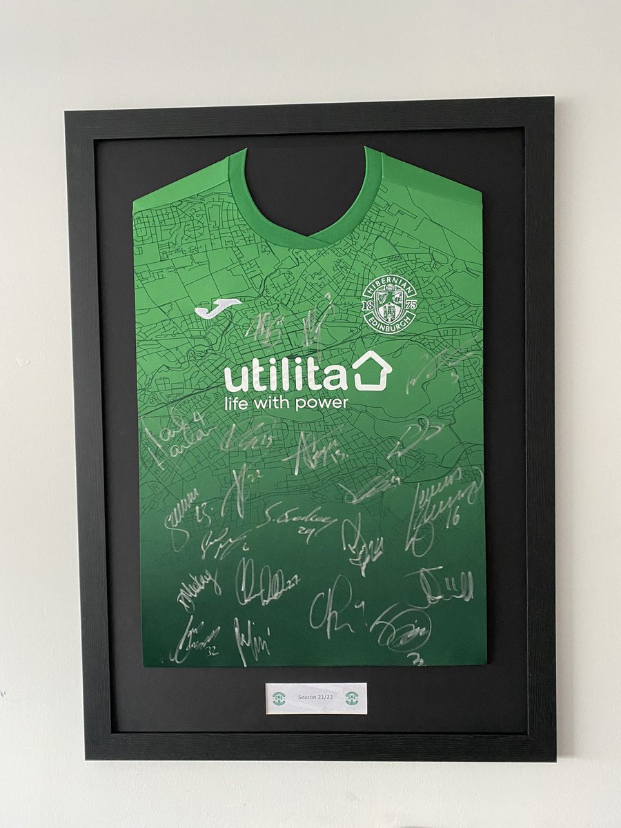 Fram3_it's tweet photo. The green looks  🔥on the black mounting. Can you believe people leave signed shirts in the cupboard ?! 🤯

#HFC #Hibees https://t.co/o98vEtAdrK