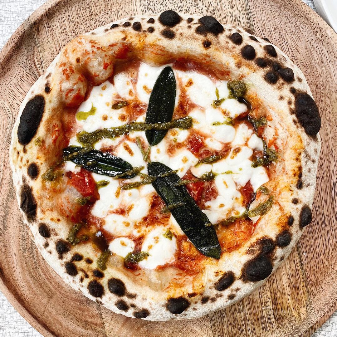 Chris (aka #Doughballdisco) wanted to do something a little different with one of his recent bakes. He calls it, “a simple Marg," but here’s what he’s changed: “instead of basil, [it’s] topped with fried sage and rocket pesto to bring a little twist to the queen.” Delish!