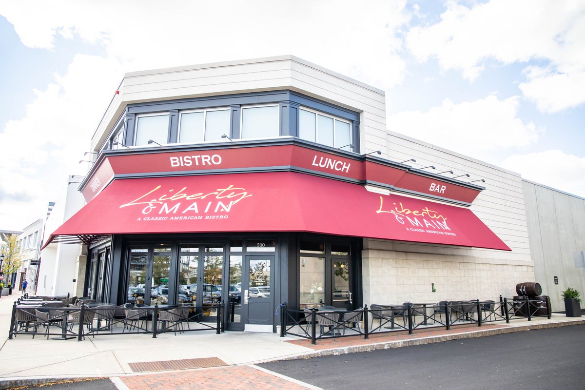 Liberty &amp; Main is a new American bistro offering menus drawn from owner Michael Feighery’s extensive travels. Our team created unique tufted barstools, dining chairs and booth seating upholstered in vibrant colors to complement the bistro's bright and welcoming atmosphere!