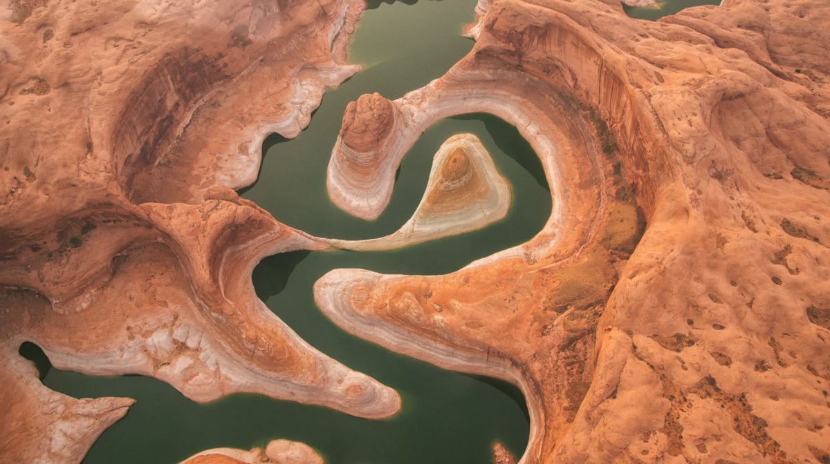 The winding stream of Lake Powell, which has fallen to its lowest level on record since it was first filled more than 50 years ago.