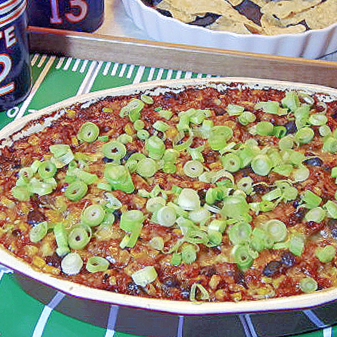 Cheesy Corn and Black Bean Dip is a deliciously easy and cheesy dip that everyone gravitates to when it's out on the table.  #appetizer #newyearsfood #partysnacks #recipe kudoskitchenbyrenee.com/corn-black-bea…