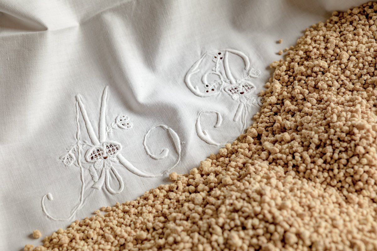 ArgiolasWinery's tweet photo. Small grains of durum wheat semolina flour,  processed with a few simple ingredients, shaped by the circular movements of the fingertips on a terracotta bowl. And, finally, the rest over a clean cotton cloth.

#Fregola being worked on for the holidays here at #Argiolaswinery 🙂 https://t.co/I1ZmzjMH2K