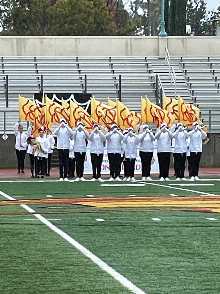 The Pasadena City College Tournament of Roses Honor Band is on the field playing Everything is Coming Up Roses.