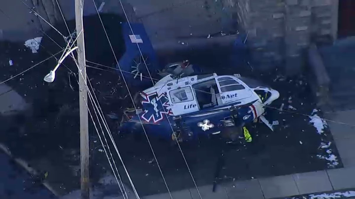 NBCPhiladelphia's tweet photo. Images show a crashed medical helicopter outside a Delaware County church. https://t.co/AZNGSRmWc1 https://t.co/OqSpzen6St