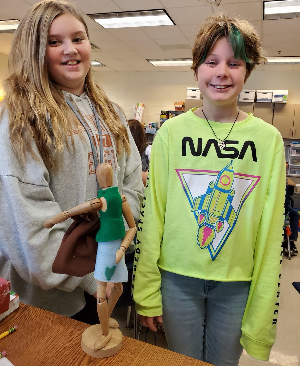 #SoftStart in AIM class at #KnoxESKnights 
Future clothing designers using only staples, tape, scissors, and a great imagination!  That's a drawstring backpack, by the way, on the artist's drawing wooden figure.