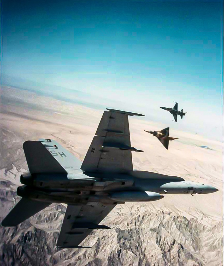 kadonkey's tweet image. WWE feature. A U.S. Marine Corps McDonnell Douglas F/A-18A Hornet of Marine Fighter Attack Training Squadron VMFAT-101 engages in air combat maneuvering with IAI F-21A Kfir and Northrop F-5E Tiger II aggressor near MCAS  Yuma in 1989.