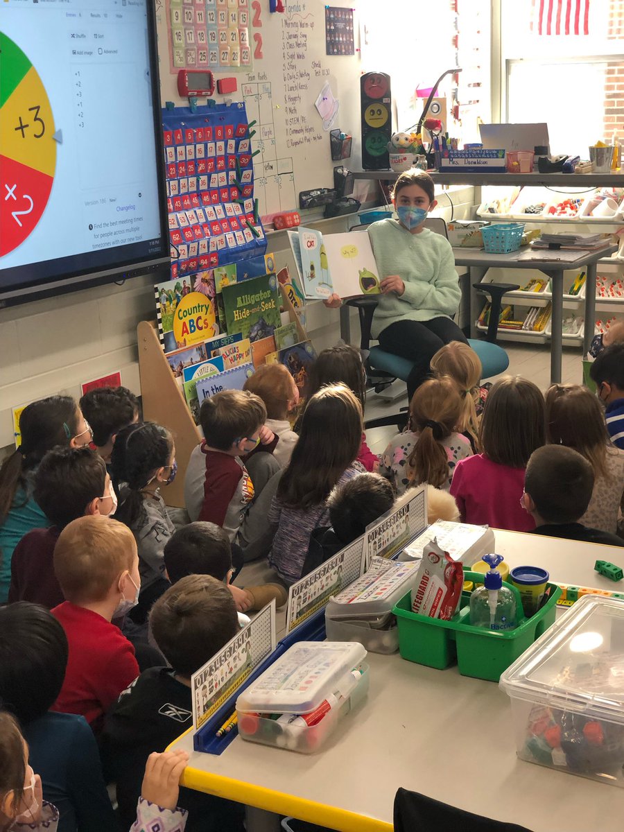 Hi. I'm Elena, Tweeter of the Day. I won the raffle &amp; chose a coupon to read to another class, which was Mrs. Donaldson's K class. I read the book, I Don't Want to be a Frog by Dev Petty. I enjoyed reading this because I like interacting with other kids. #21learns
