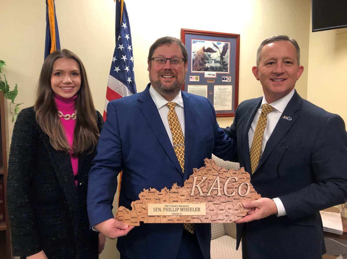 Sen. Phillip Wheeler accepts a KACo County Advocate award from Executive Director Jim Henderson and Gracie Lagadinos, KACo Associate Director of Government Affairs. The award is presented to legislators who supported counties throughout the 2021 session. #CountiesMatter