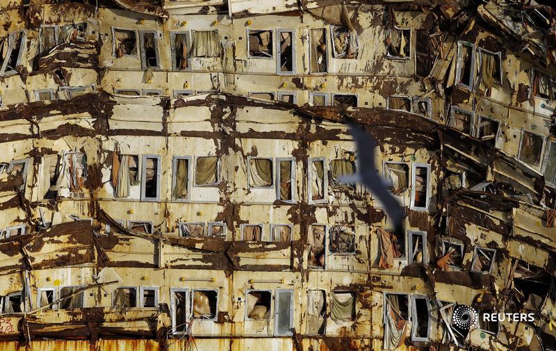reuterspictures's tweet photo. This year marks the 10th anniversary of the Costa Concordia cruise ship disaster that killed 32 people after it capsized and sank off shore, at Giglio island, Italy. More photos:  https://t.co/gIuRSCUfHw https://t.co/xHD8LsRexW