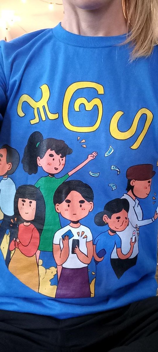 She: What does your shirt say?
Me: It says 'please donate' in Burmese!

And then I told her all about Click2Donate and how Myanmar people are supporting each other financially by simply playing videos on Youtube.