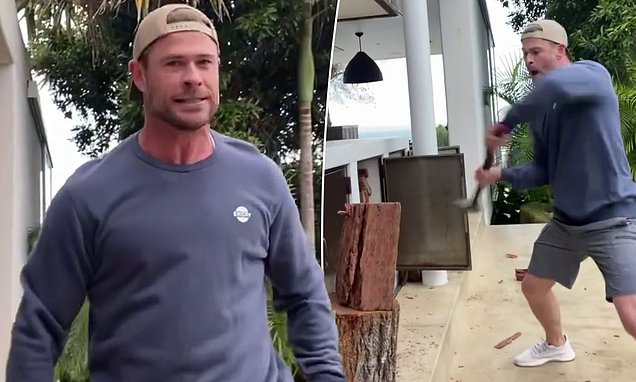 Chris Hemsworth flaunts his Thor strength and massive biceps in a tight top as Marvel hunk battles to chop some wood https://t.co/tPKRiNZ3Hn https://t.co/As9MIHRSiC