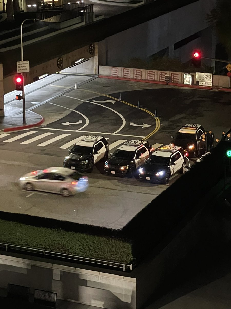 roxndt's tweet photo. Police having a gathering while cars race up and down on lower Grand and Upper Grand… and the people racing doesn’t seem to give a damn #lapd #racing #downtownracing #dtla https://t.co/4pQBDQ0o0U