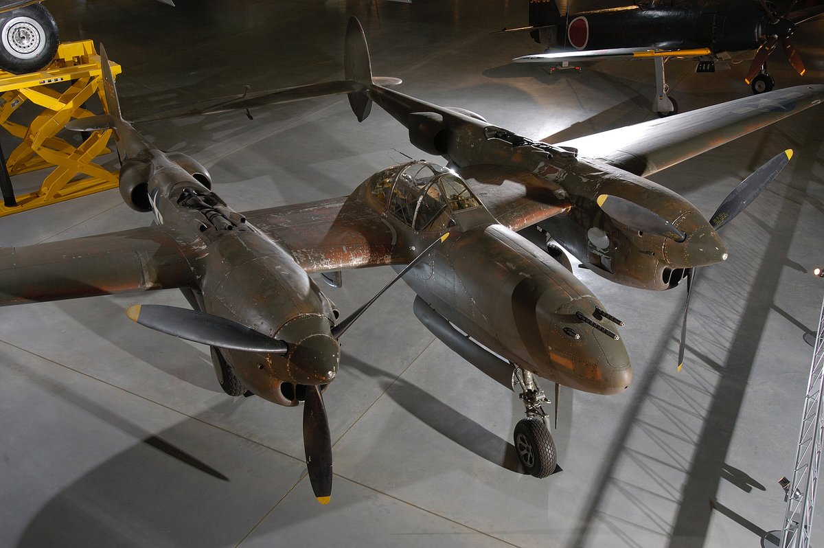 P-38 aircraft on display in museum setting and viewed from a top angle.