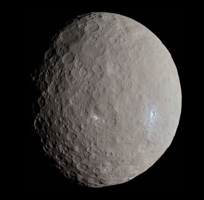A view of dwarf planet Ceres against an all black backdrop.