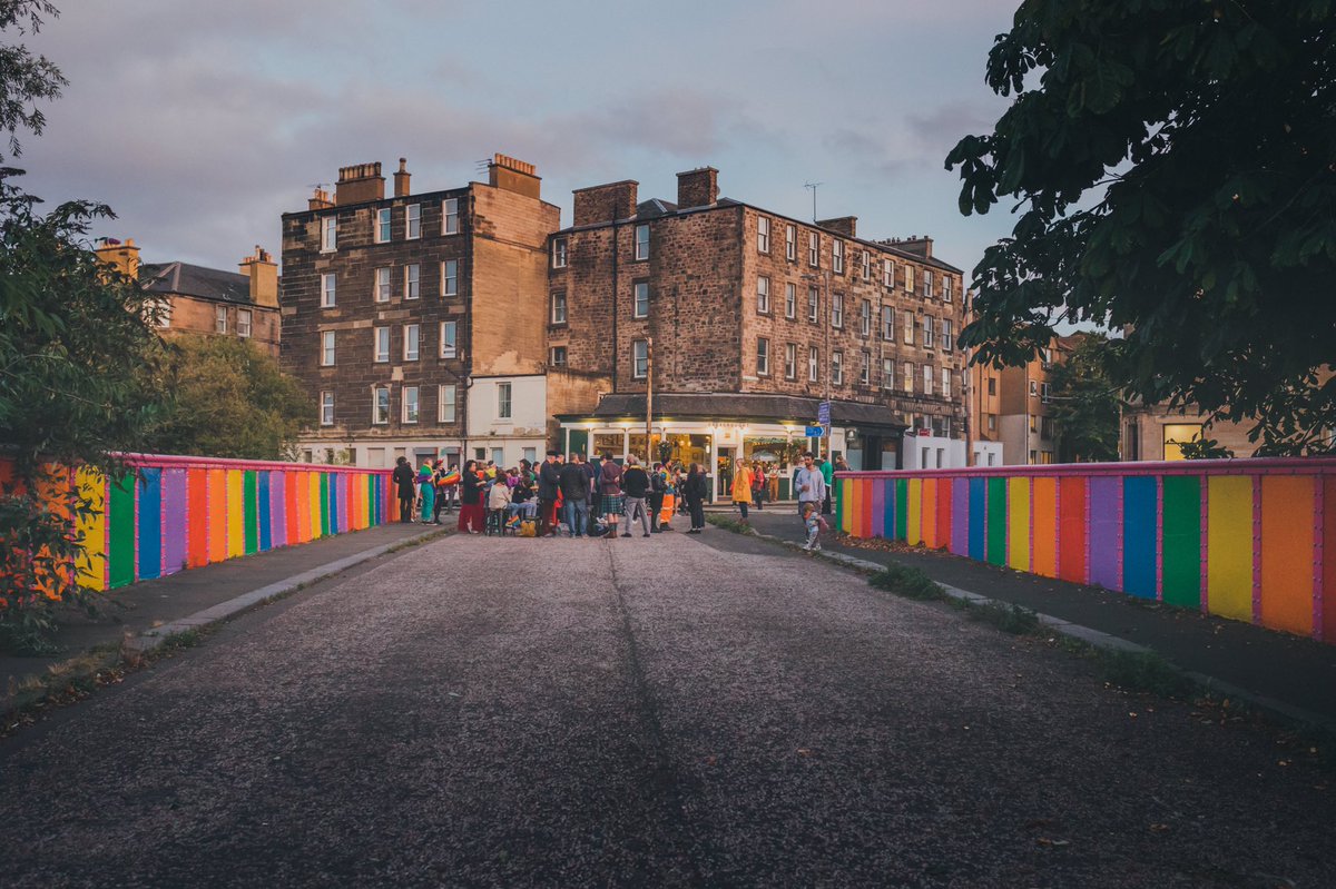 Somewhere_ForUs's tweet photo. Thanks to the support of our members, we funded the paint for the fab #PrideBridge outside the @DreadnoughtPub in Leith. Seeing RΓ³isΓnβs vision turn into a reality with the incredible support of the community was one of our 2021 highlights. Itβs Scotlandβs newest LGBTQ+ landmark! https://t.co/BBbx9IvA1q