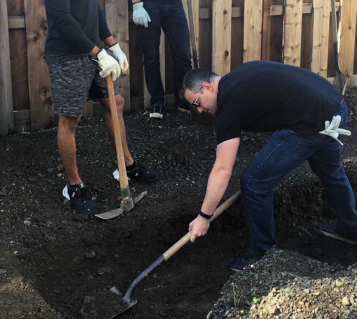 OurTownStHelena's tweet photo. Volunteer day at Brenkle Court. Project Manager Larry Vermeulen likes to give everyone a shot at digging gas lines. #buildingaffordablehousing, #AffordableHousing https://t.co/7AgNbvQUt7
