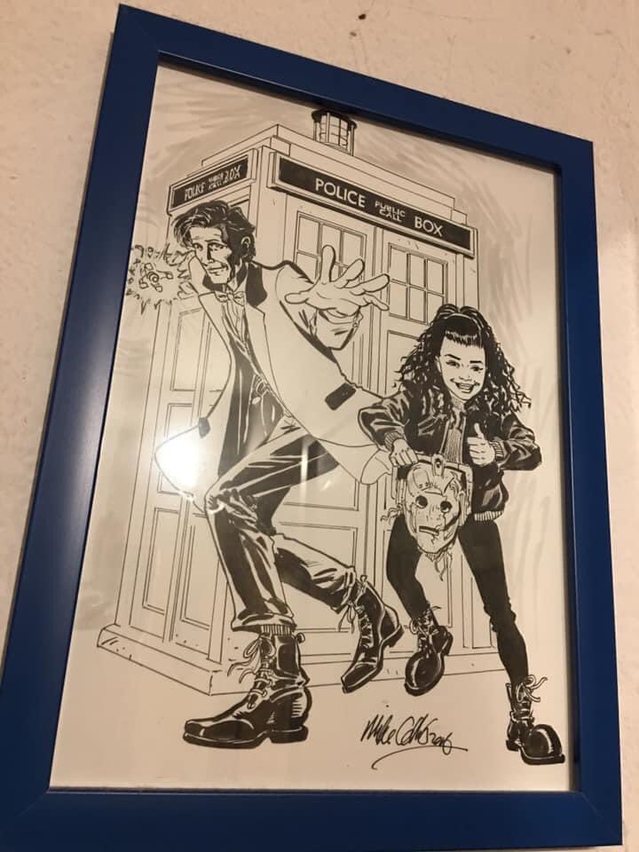 Zebra_carol's tweet photo. Throwback 2019 - Today is ‘National Fez Day’ (Not really made that up)
#ThingTwo loves #DoctorWho #MattSmith “Fez’s are cool’ she’s wearing it just because she can 😜
We even got #comicartist chum for the Dr Who magazine to draw her as his companion
Good job we’ve got a #TARDIS https://t.co/UXfwvC2hK2