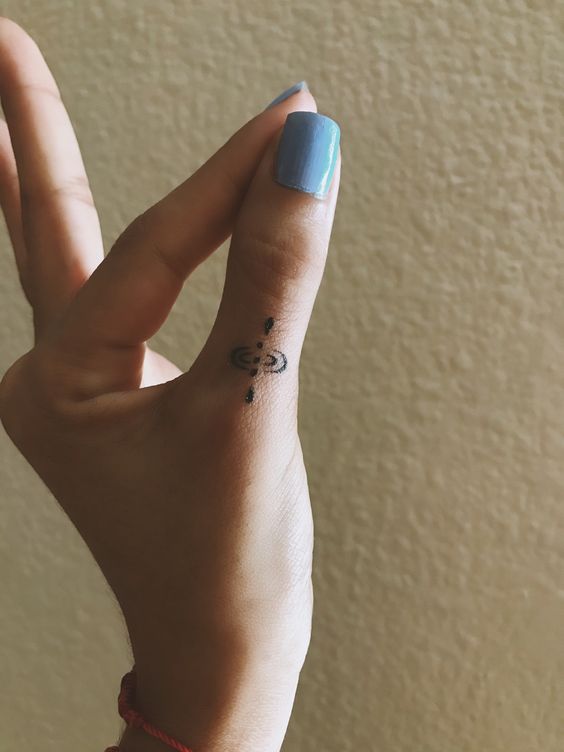 radicalcourse's tweet photo. Mindfulness symbol finger tattoo https://t.co/5swibMLtQS