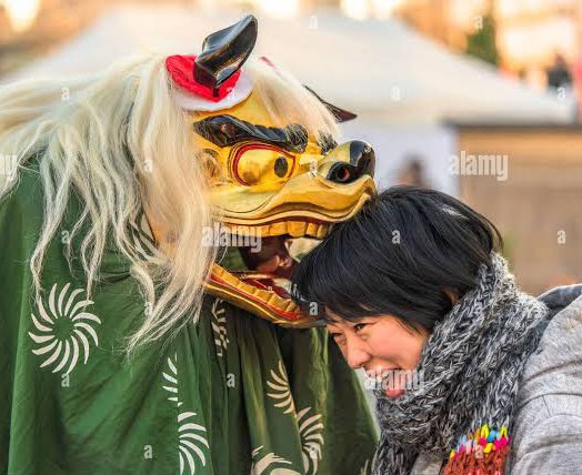 fucksukuna's tweet photo. shishimai (lion dance) is performed every new year and people let their heads get bitten for tradition for good luck , and as for kids, for them to get strong and smart

so technically bakugou lion is giving kirishima the "lucky bite" 😭 https://t.co/0t4U2DsOXD