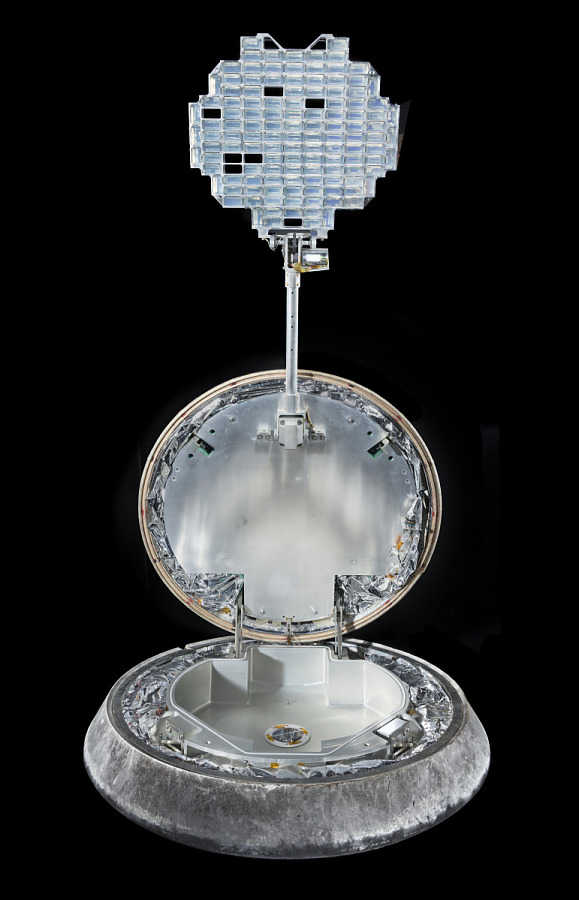 Stardust capsule photographed against a black backdrop.