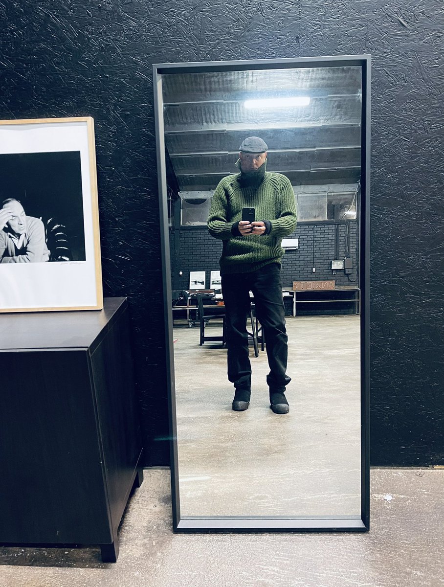 trying moss green handknitted sweater prototype in eco wool from Öland for my upcoming brand AS (under anxious surveillance of Mr Bergman).