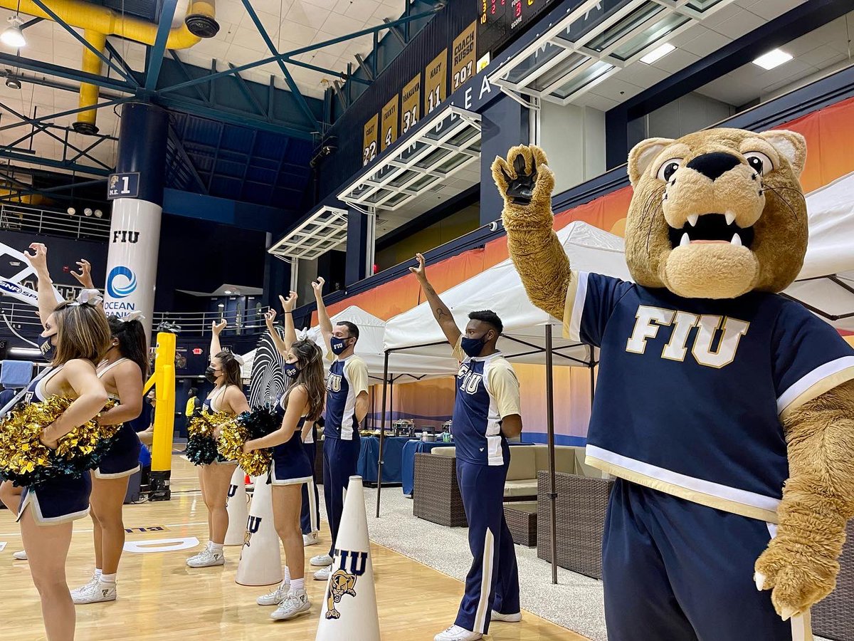 FIUCheer's tweet photo. 🥳 We started the New Year off strong, cheering-on and celebrating WINS from both @FIUHoops &amp; @FIU_WBB 🏀

#PawsUp 🐾 #FIUSpirit 💙💛 https://t.co/N5IJYU7oLd
