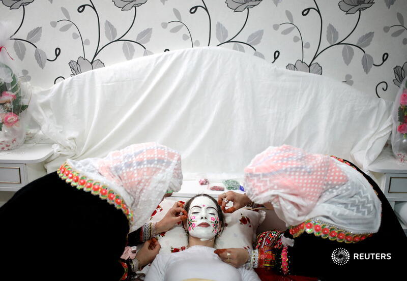 A Bulgarian Muslim bride prepares for her traditional wedding ceremony covering her face in thick, chalky white paint, in the remote mountain village of Ribnovo in southwest Bulgaria. More photos: reut.rs/3sPLzUp 📷<a href="/nenovstoyan/">stoyan nenov</a>