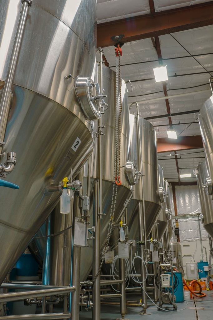 A row of fermenters works overtime to bring the best beer possible to the year 2022. What was the first beer you had this year?