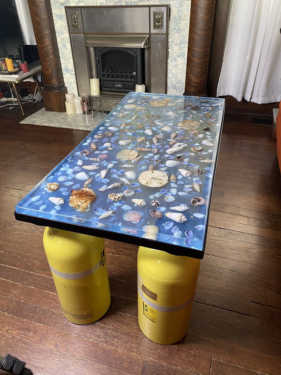 Finished making a #epoxy #seashell #coffeetable out of some shells my grandma gave me years ago and some old #SCBA air tanks #ecopoxy  #ecopoxytable #epoxyresin #epoxypour #thanksgrandma #epoxycoffeetable #epoxytable  #resinart #airtank #welding #fabrication #customtable #diy