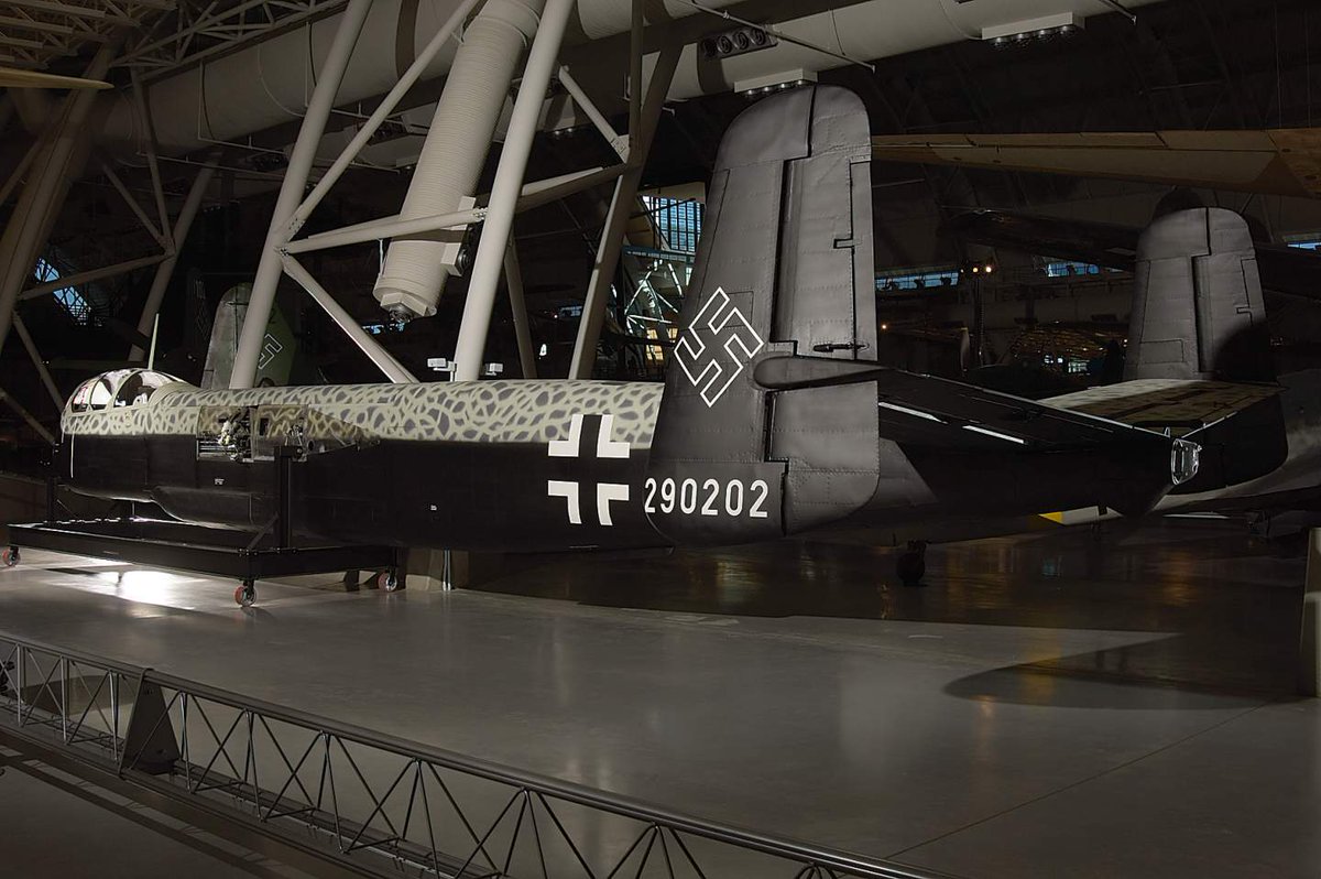Black and green aircraft with swastika painting on the tail on display in museum 