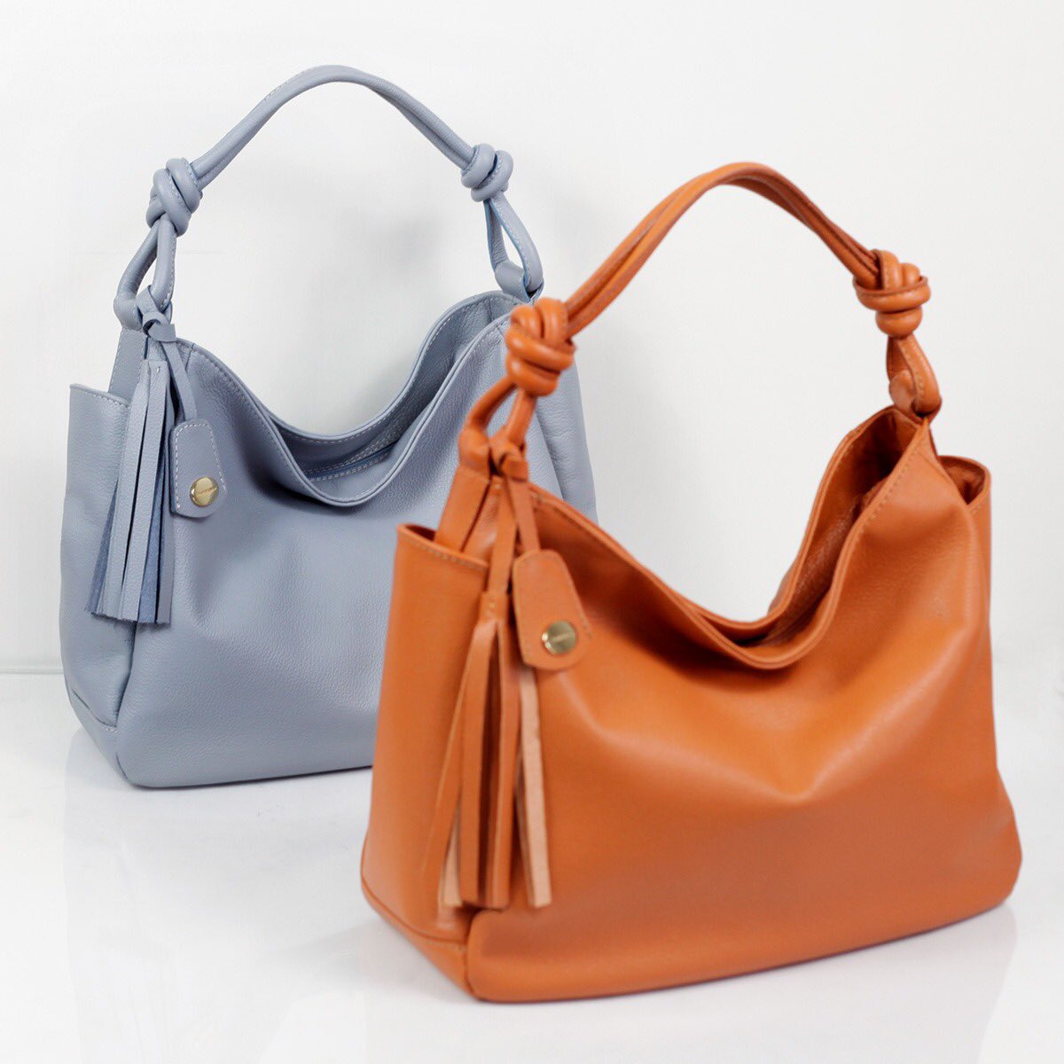 blue bolsa with brown handle