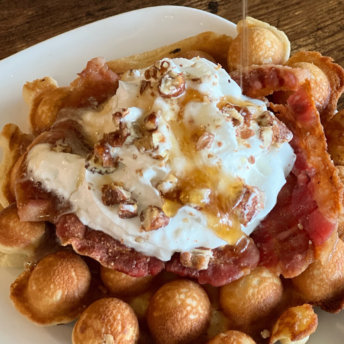 First a new year, now a new moon, and with it an epic new lunar cycle waffle. Maple + Bourbon + Bacon + Pecan Pralines With a hot maple bourbon syrup drizzle, this waffle is loaded with bacon, whipped cream, and candied pecan pieces. See you soon… #🌜🍁🥃🥓🌛