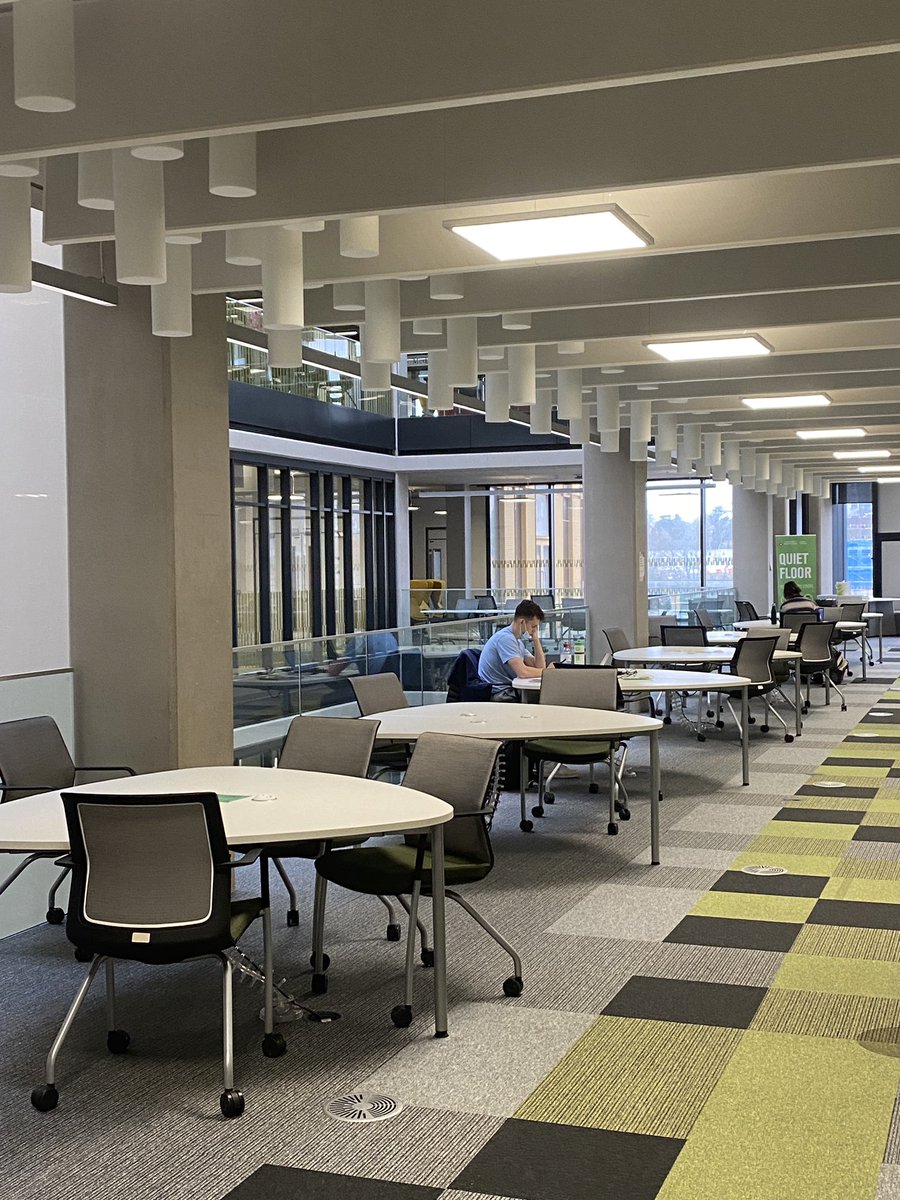 Photograph of the study space in the first floor of Main Library. We can see one or two students working in the distance
