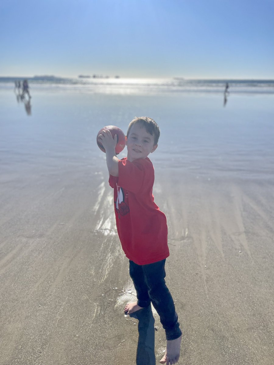 sixpacabbs00's tweet photo. My 5 year old son was playing football on the beach. He stopped and asked me to take this picture of him. "Mom, do I look like Cam Rising?" What do you think @crising7?? https://t.co/Xp0kzdATCO