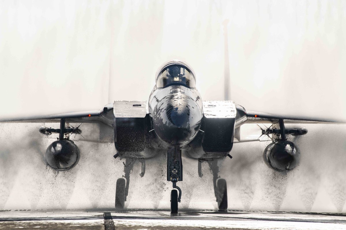 An @usairforce F-15C Eagle assigned to the 67th Fighter Squadron taxis through a wash system bath after a training sortie at @KadenaAirBase.