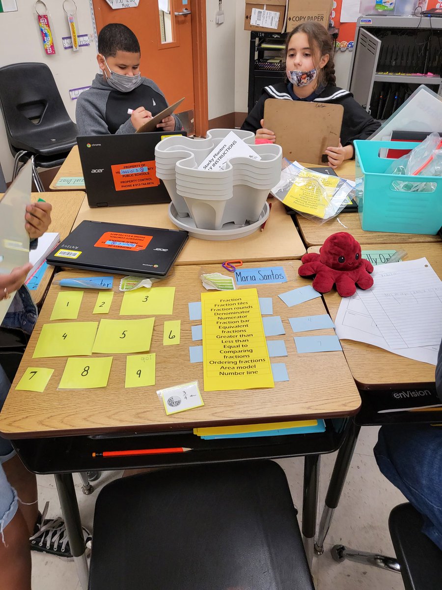 Rocks4th's tweet photo. First day back and my kids are working hard at a fraction vocabulary game. 
@Crestwood2021 
@HCPSElemMath1 https://t.co/evHGgblZlF